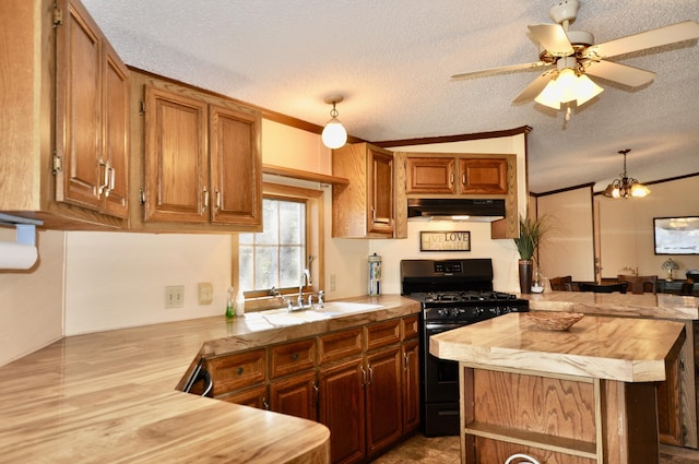 kitchen with black range with gas stovetop, under cabinet range hood, butcher block counters, a textured ceiling, and a ceiling fan