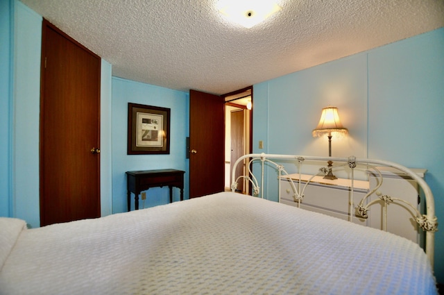 bedroom featuring a textured ceiling