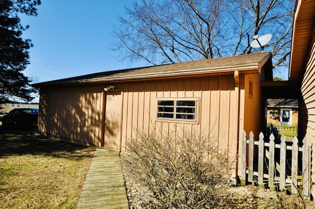 view of outdoor structure featuring fence