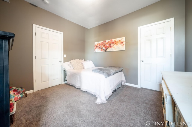 carpeted bedroom featuring baseboards