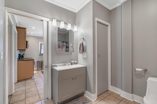 full bath featuring toilet, crown molding, tile patterned flooring, baseboards, and vanity