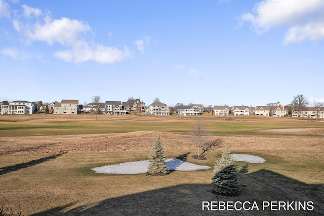 surrounding community featuring a yard and a residential view