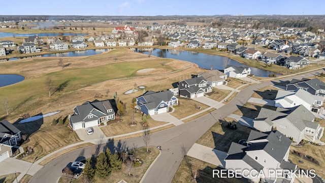 birds eye view of property featuring a residential view and a water view