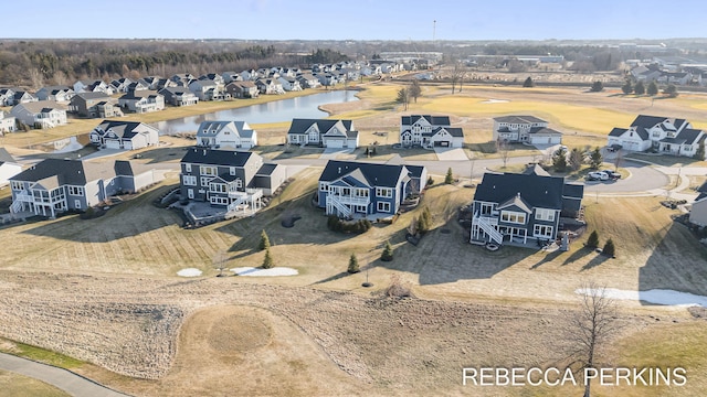 aerial view featuring a residential view and a water view