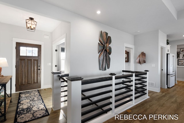 entrance foyer featuring an inviting chandelier, recessed lighting, wood finished floors, and baseboards