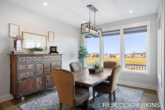 dining area featuring dark wood finished floors, recessed lighting, and baseboards