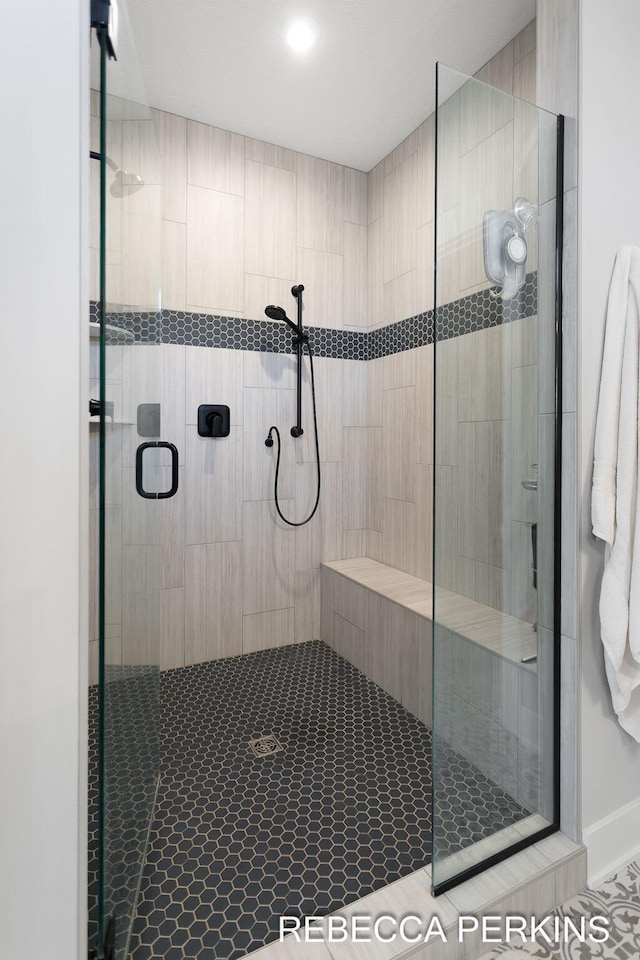 bathroom with a shower stall