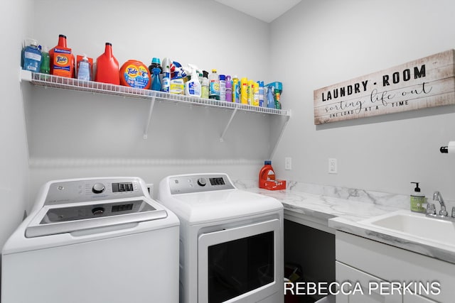 laundry area featuring separate washer and dryer and laundry area