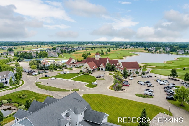 birds eye view of property featuring golf course view and a water view