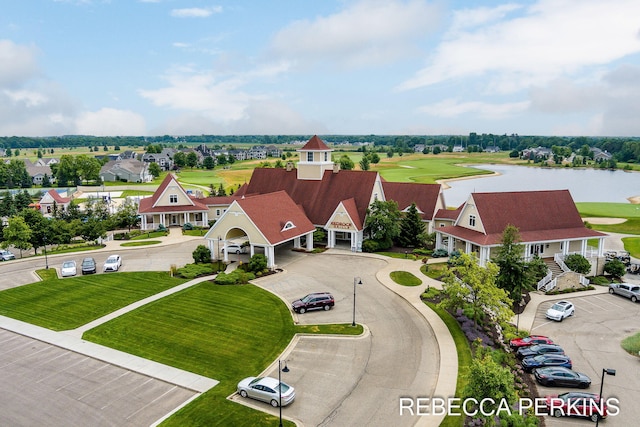 birds eye view of property with a water view