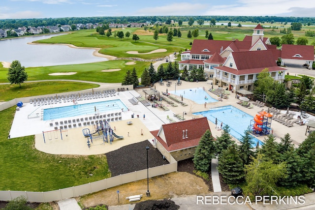 aerial view featuring golf course view and a water view