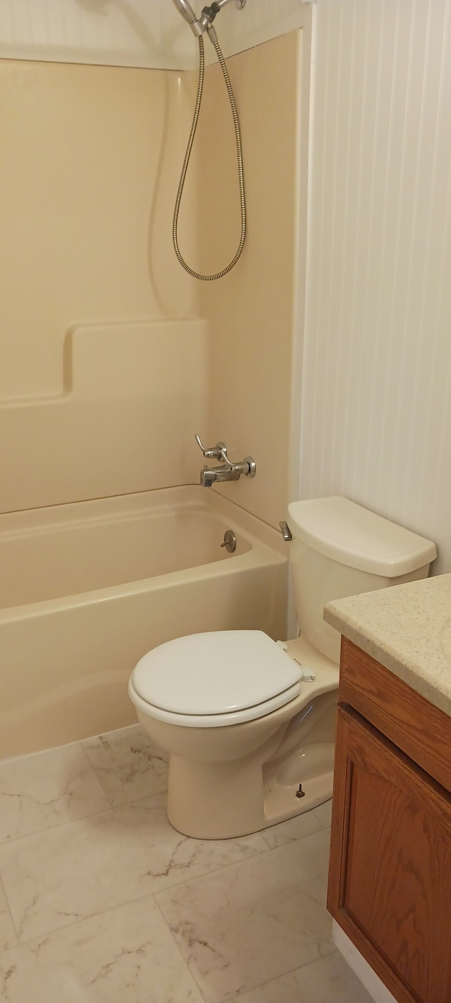 full bathroom featuring shower / washtub combination, marble finish floor, toilet, and vanity