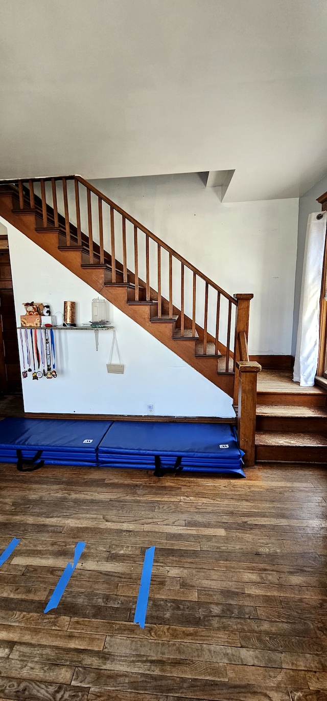 staircase featuring hardwood / wood-style flooring