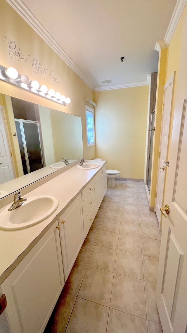 full bath featuring a sink, visible vents, ornamental molding, and tile patterned flooring