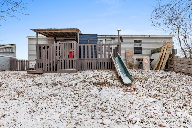 back of house featuring fence