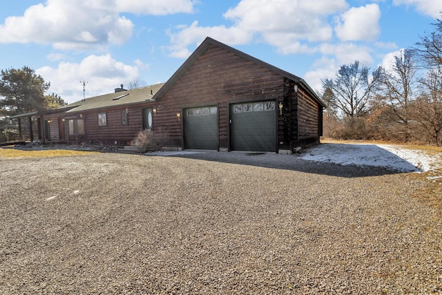 view of front of home featuring a garage and driveway