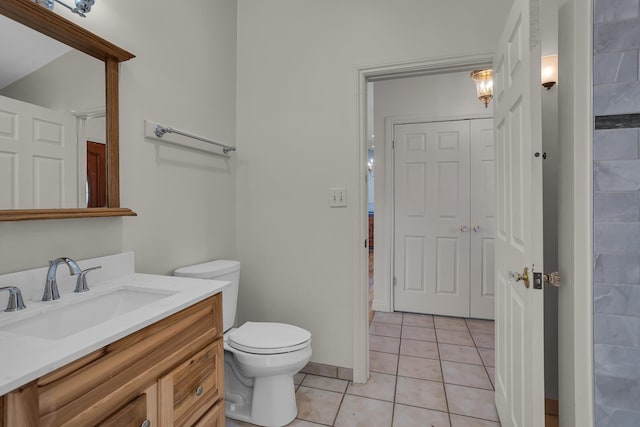 full bath featuring vanity, tile patterned floors, and toilet