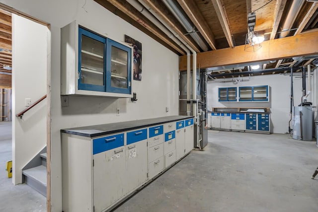 unfinished below grade area with gas water heater and stairway