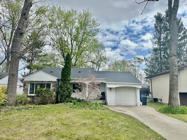 4120 Lotus Dr, Waterford, MI 48329 - view of front of home featuring a garage, driveway, a front yard, stone siding, and roof with shingles