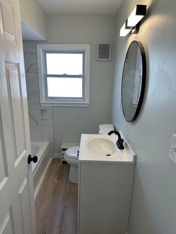 4120 Lotus Dr, Waterford, MI 48329 - bathroom featuring vanity and wood finished floors