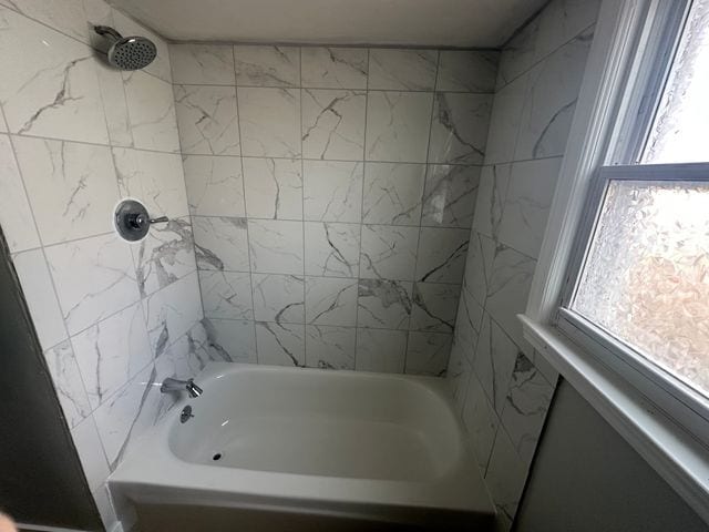 4120 Lotus Dr, Waterford, MI 48329 - full bathroom with healthy amount of natural light and shower / bathtub combination