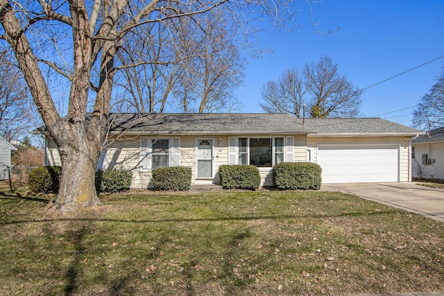 ranch-style home with a garage, concrete driveway, and a front yard