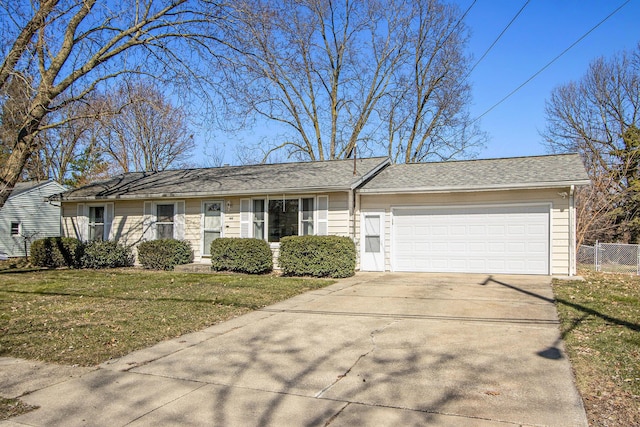 ranch-style home featuring driveway, a front lawn, a garage, and fence