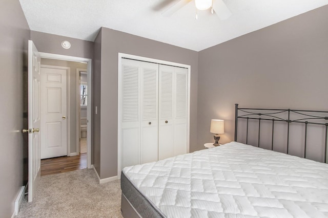 bedroom featuring baseboards, a closet, carpet floors, and ceiling fan