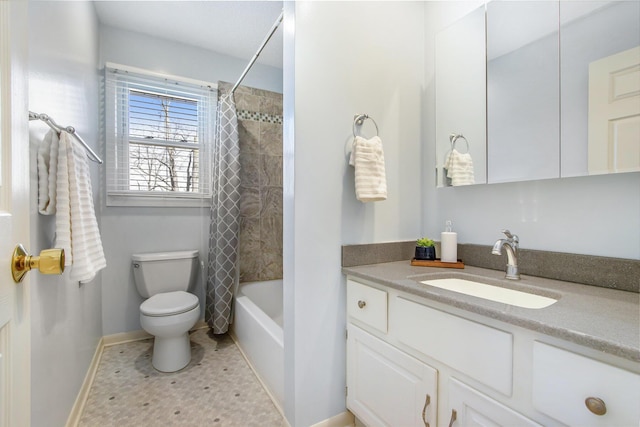 full bath featuring vanity, baseboards, tile patterned flooring, shower / tub combo, and toilet