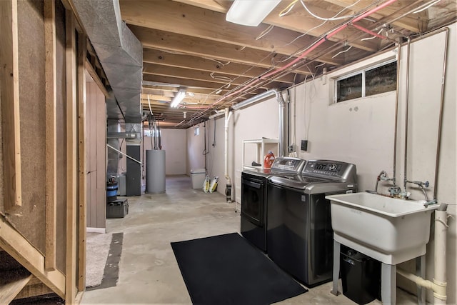 unfinished below grade area with water heater and separate washer and dryer