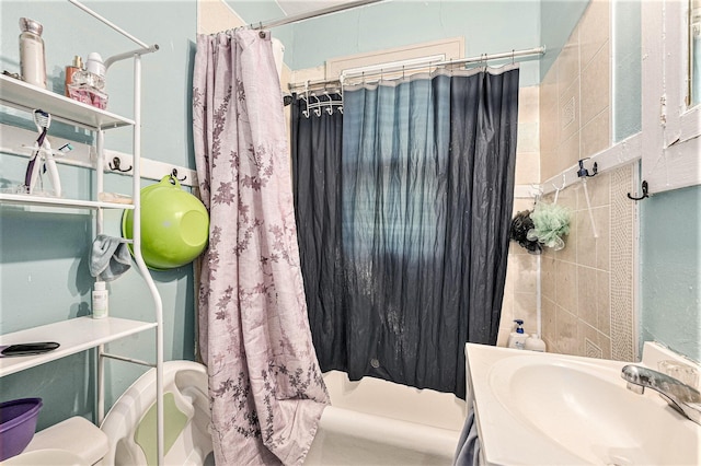 bathroom featuring vanity, toilet, and shower / bath combo with shower curtain