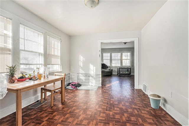 interior space featuring baseboards and visible vents