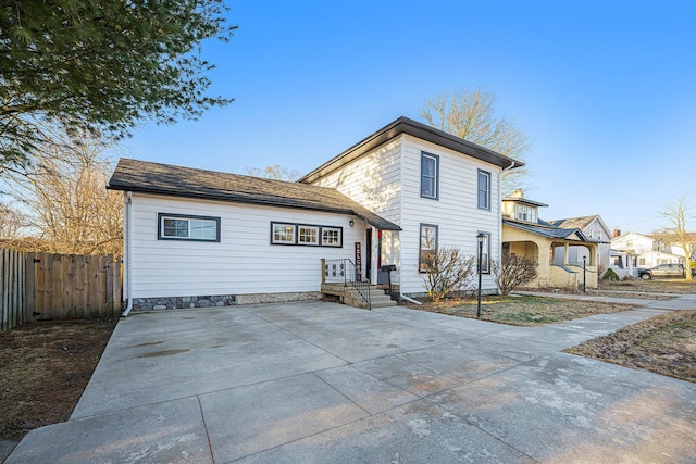 view of front of house featuring fence