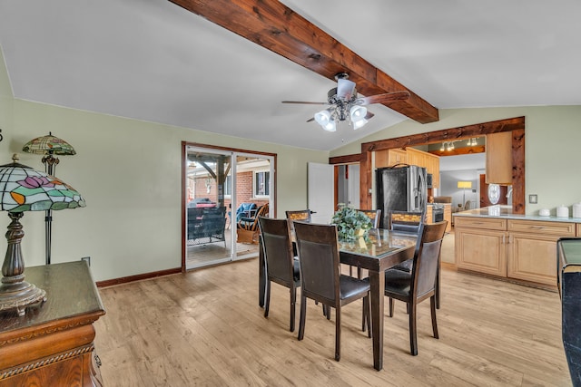 dining room with lofted ceiling with beams, baseboards, light wood-style floors, and a ceiling fan