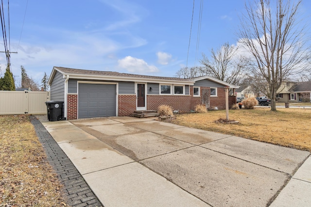 ranch-style home with fence, driveway, entry steps, a garage, and brick siding