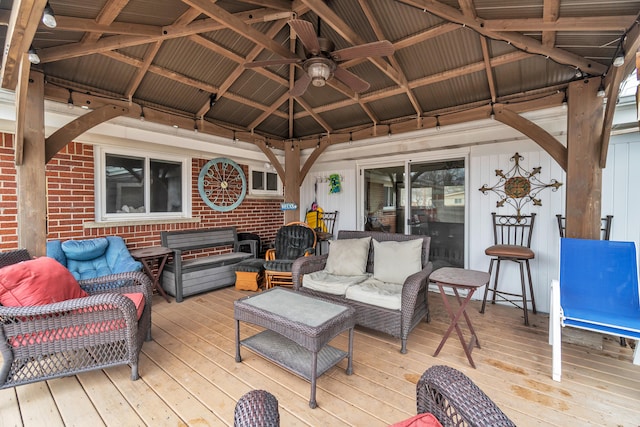 deck with a gazebo and outdoor lounge area