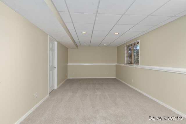 interior space featuring recessed lighting, baseboards, and a drop ceiling