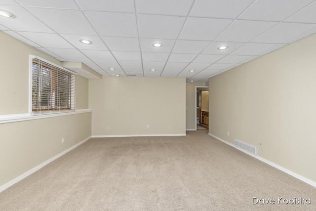 empty room with recessed lighting, baseboards, visible vents, and carpet floors