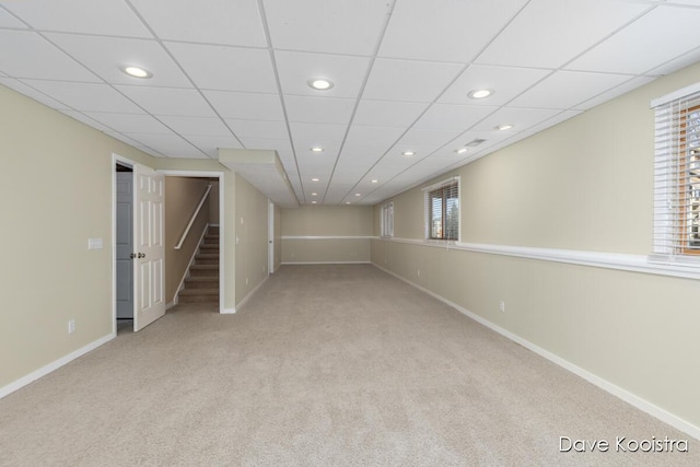 below grade area with recessed lighting, stairs, baseboards, and carpet floors