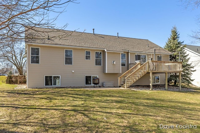 back of house with a lawn, central AC, stairway, roof with shingles, and a wooden deck