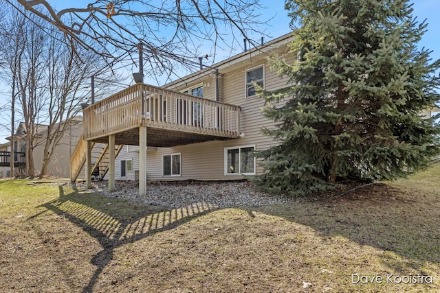 rear view of house with stairs and a deck