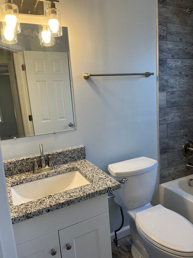full bathroom featuring baseboards, toilet, vanity, and  shower combination