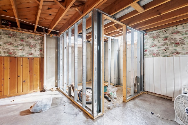 basement with a wainscoted wall