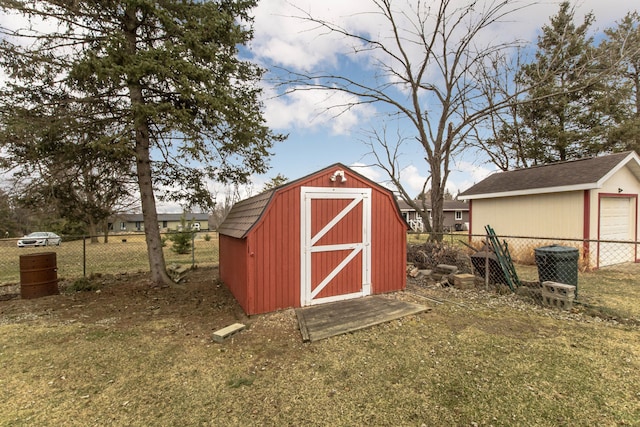 view of shed featuring fence