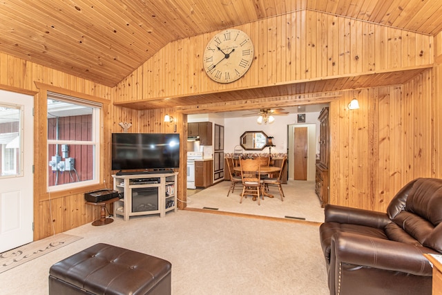 carpeted living area featuring wood walls, wood ceiling, ceiling fan, and vaulted ceiling