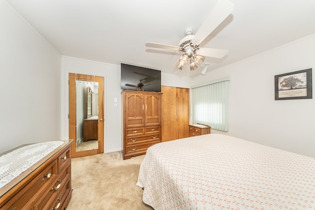 bedroom featuring light colored carpet, ceiling fan, and crown molding