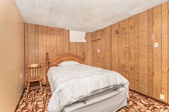 bedroom with wood walls