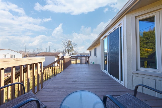 wooden deck featuring an outdoor structure