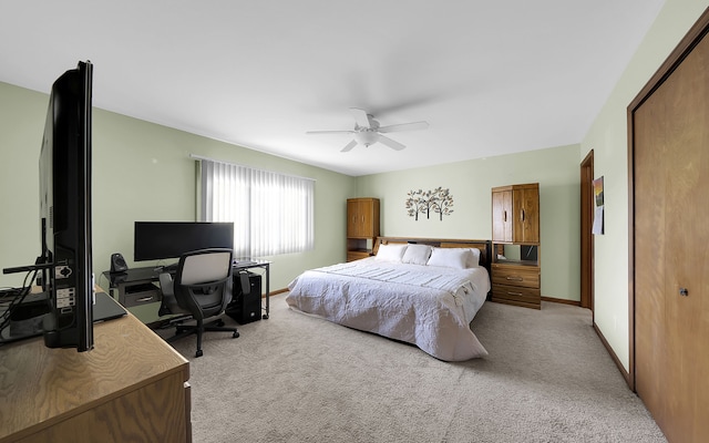 bedroom with baseboards, light colored carpet, and ceiling fan