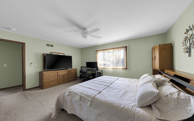 bedroom with visible vents, light carpet, baseboards, and a ceiling fan